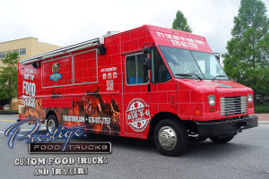 side view of red food truck