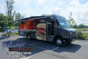 black food truck with sandwich graphic