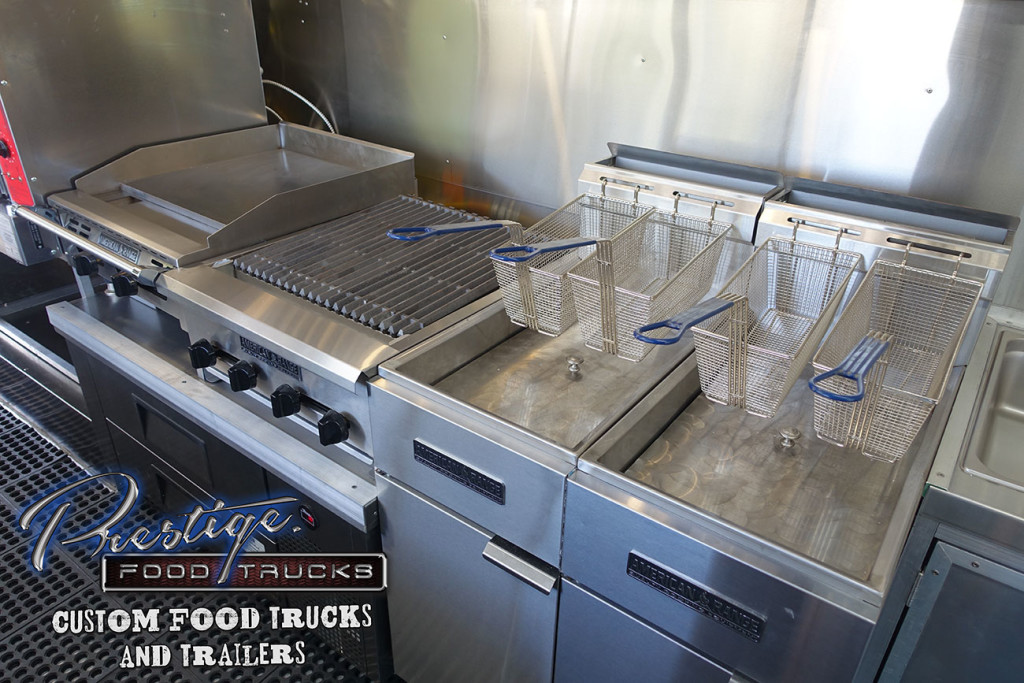 food truck/mobile kitchen interior with grill and fryers
