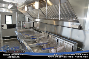 food truck interior with fryers and grill
