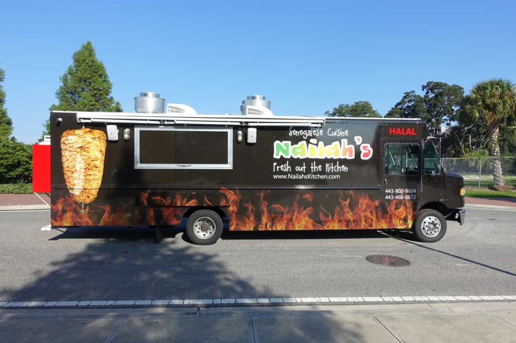 black food truck with flames graphics
