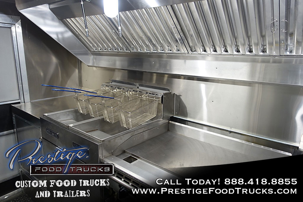 food truck interior with grill and fryers