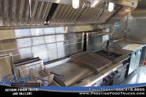 food truck interior with fryer, grill and stovetop