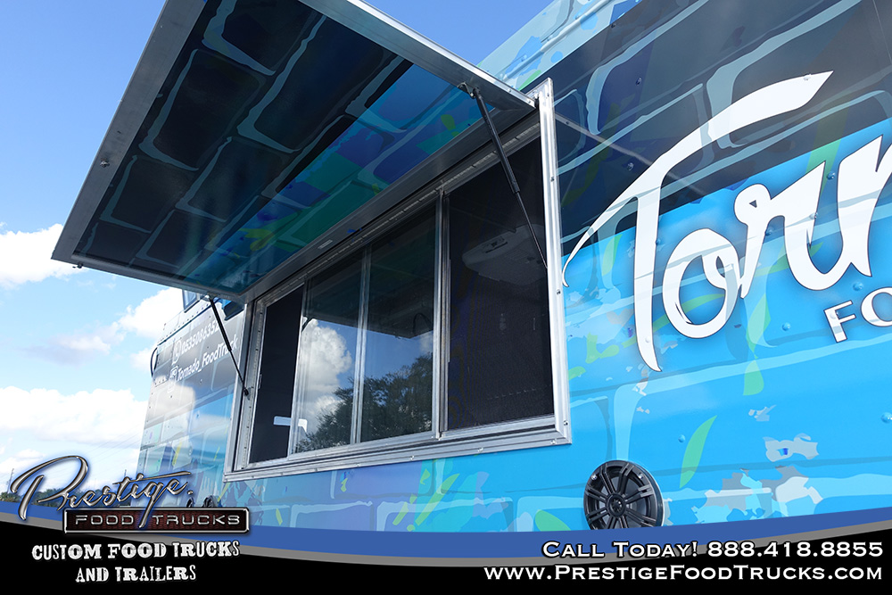 close up of service window on exterior of blue food truck