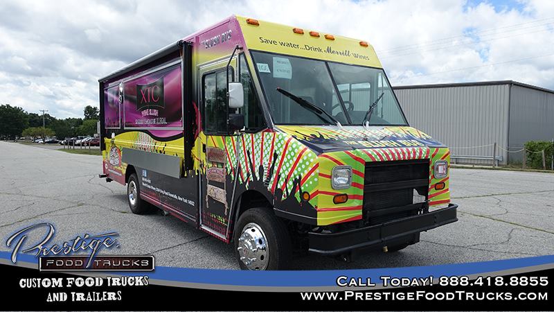 front 3/4 view of colorful food truck showing front window and side service window