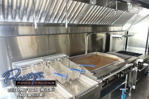 food truck interior with fryer baskets and grill