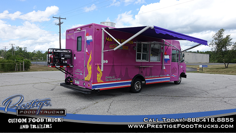 rear 3/4 view of purple food truck showing rear door and rear mounted generator, along with side service window and awning