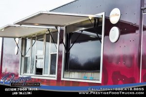 close up on mobile kitchen service window and TV display compartment