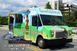 Childer's chuck wagon food truck exterior front 3/4 view with cartoon farm graphics wrap