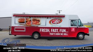 red and white food truck with food graphics