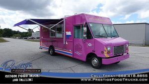 purple food truck exterior with service window and awning
