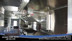 photo of food truck interior with grill and exhaust hood