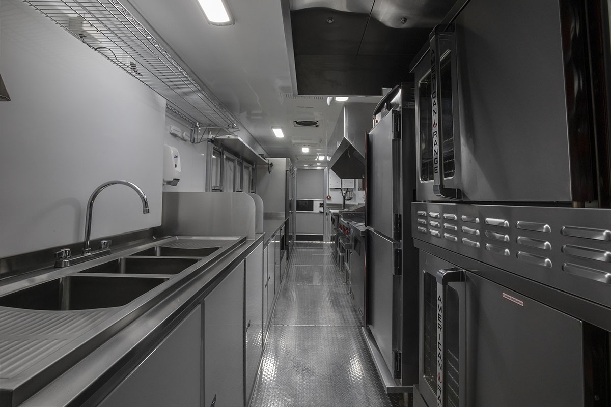 food truck interior kitchen photo showing sink and ovens