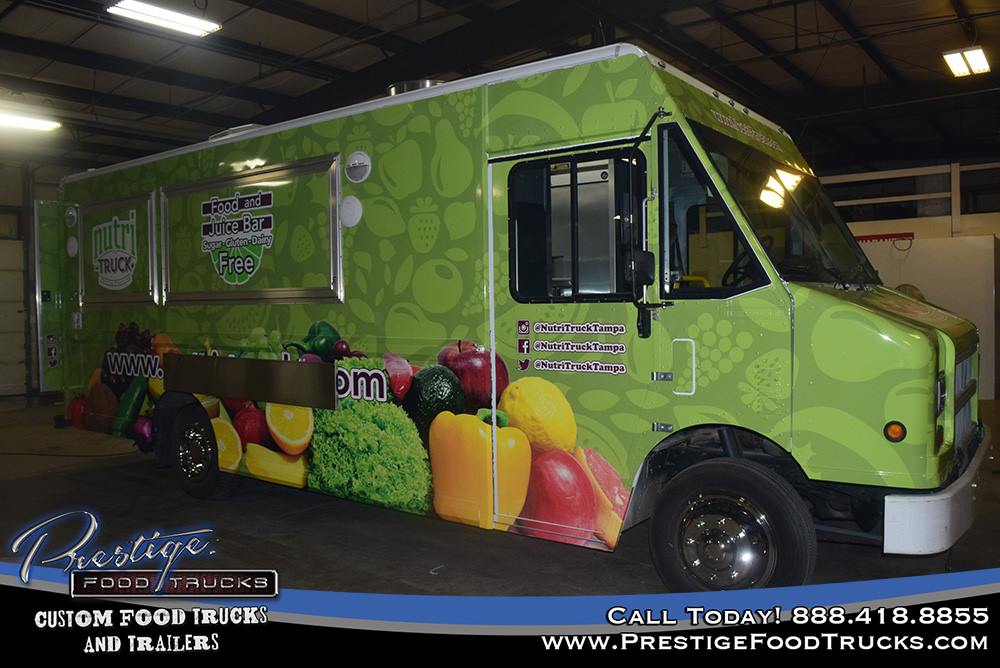 green food truck exterior with vegetable graphics