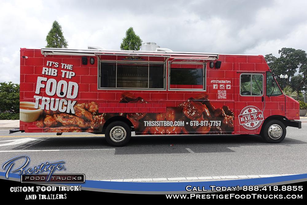 side view of red food truck with service window