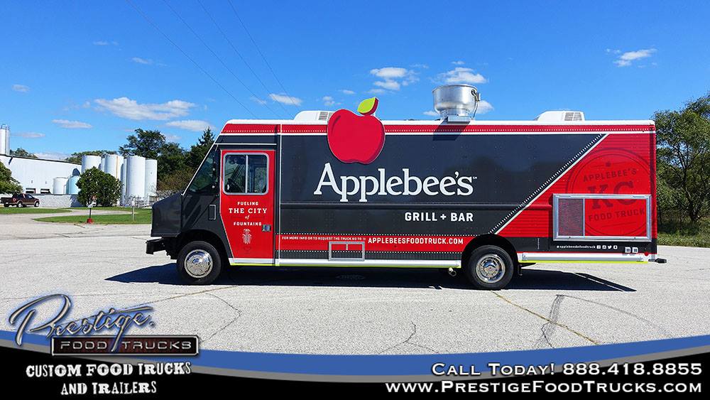 side view of red and black Applebee's food truck