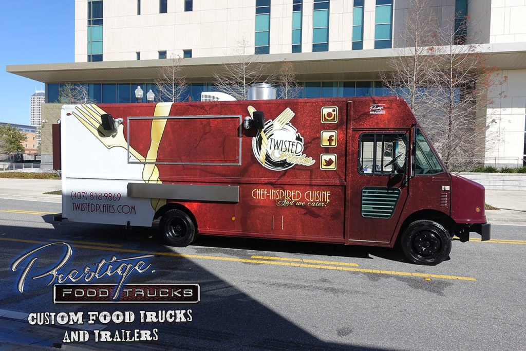 red and white food truck parked on city street