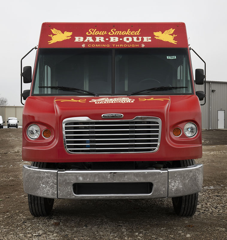 front view photo of a red food truck
