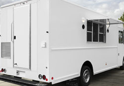 white food truck on a sunny day