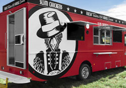 red food truck parked on grass