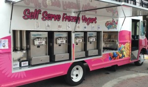 side view of frozen yogurt food truck with frozen yogurt dispensers